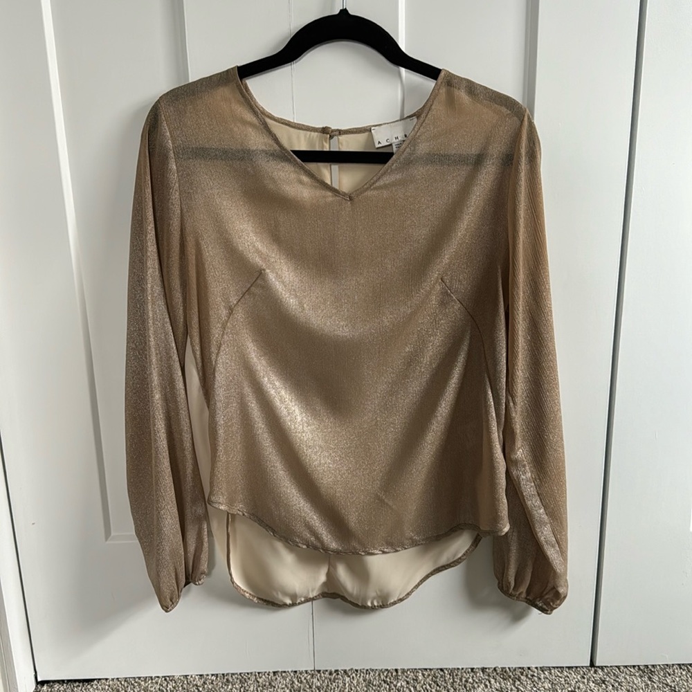 Size Small top in a gold shimmery front, cream back